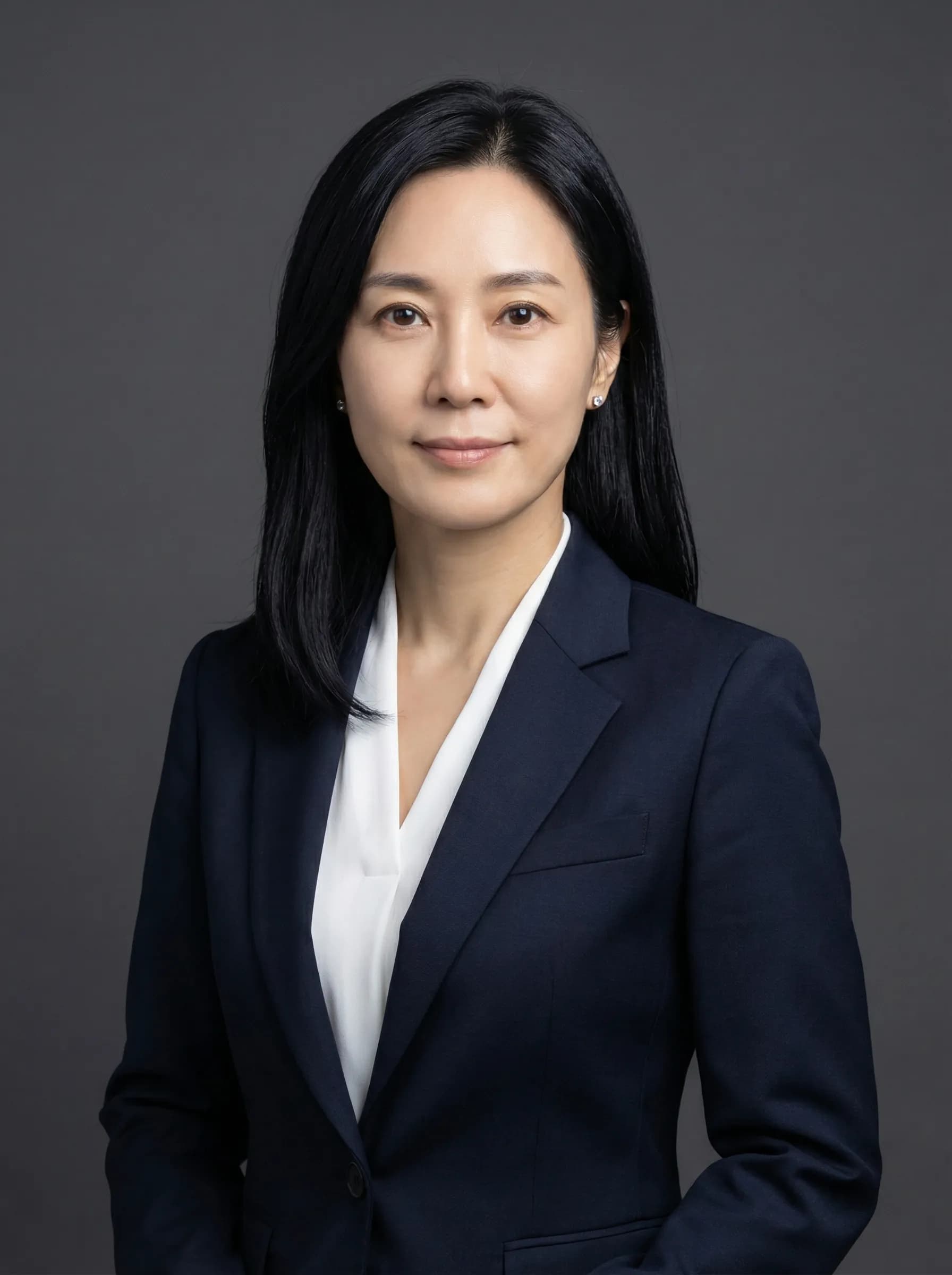 Executive portrait in tailored navy suit with leadership presence